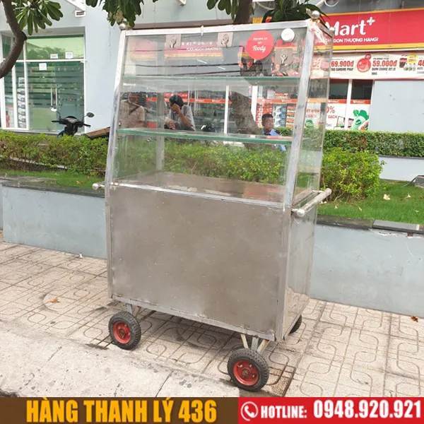 Tủ kính inox mặt kính có bánh xe, khung inox sáng bóng, mặt kính trong suốt, tình trạng mới 90%
